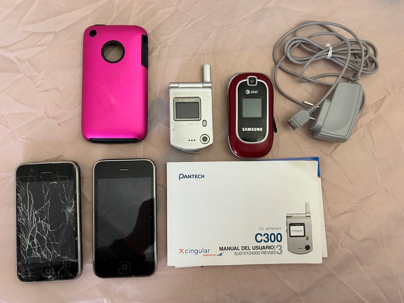 LOT Of 4 Cell Phones, 2 iPhones (model A1303), SAMSUNG FLIP & PANTECH & Book